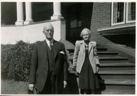 1950c Leake and Mrs Leake on the steps of their home